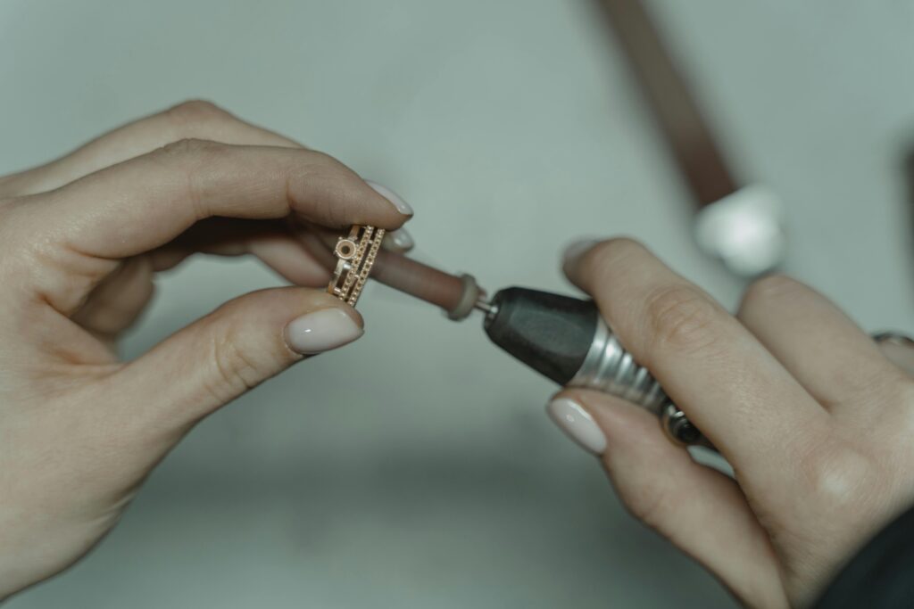 The sentimental difference: my full list of services Detailed image of crafting jewelry with precision tools indoors.